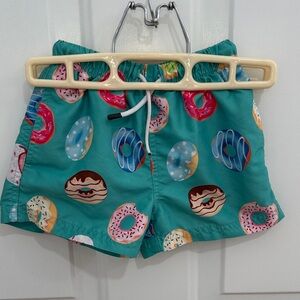 Vibrant Teal Kids Swim Trunks with Donut Design